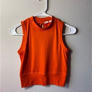 Orange sleeveless open back crop top